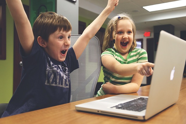 children playing a video game and excited